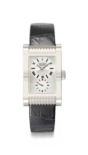 Rolex. An 18K white gold rectangular curved wristwatch