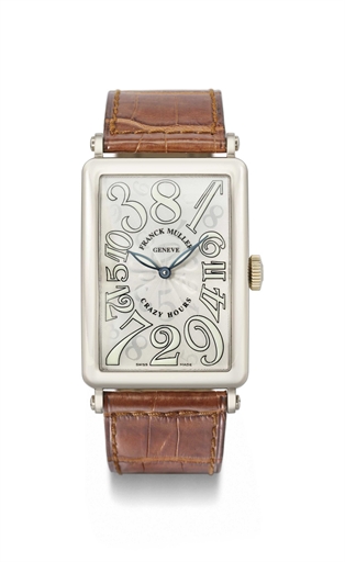 Franck Muller. An 18K white gold tonneau-shaped automatic wristwatch with jumping hands and crazy hour dial