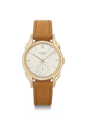 Patek Philippe. A rare and highly decorative 18K pink gold wristwatch with fluted lugs and original box