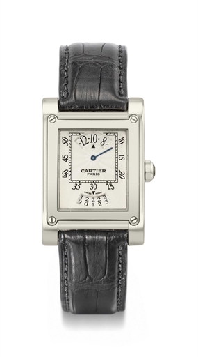 Cartier. A fine 18K white gold rectangular wandering hour wristwatch with date