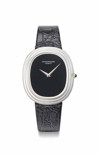Patek Philippe. An 18K white gold oval automatic wristwatch with onyx dial