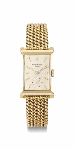 Patek Philippe. A fine and rare 18K gold rectangular wristwatch with bracelet