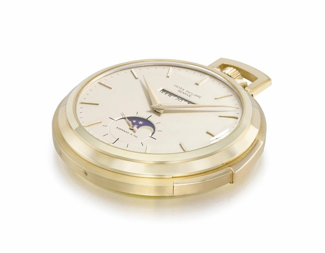 Patek Philippe. A very fine and rare 18K gold openface minute repeating perpetual calendar keyless lever watch with phases of the moon and original certificate