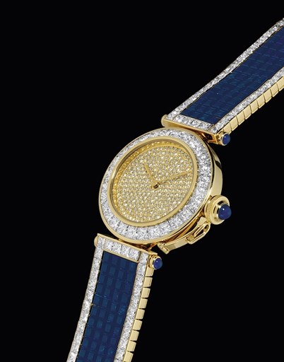 CARTIER. A VERY IMPRESSIVE AND RARE 18K GOLD, DIAMOND AND SAPPHIRE-SET AUTOMATIC BRACELET WATCH