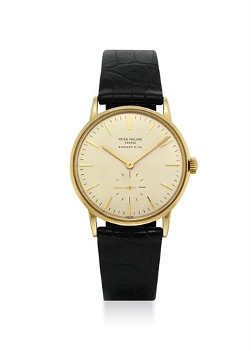 PATEK PHILIPPE. AN 18K GOLD AUTOMATIC WRISTWATCH, RETAILED BY TIFFANY CO.