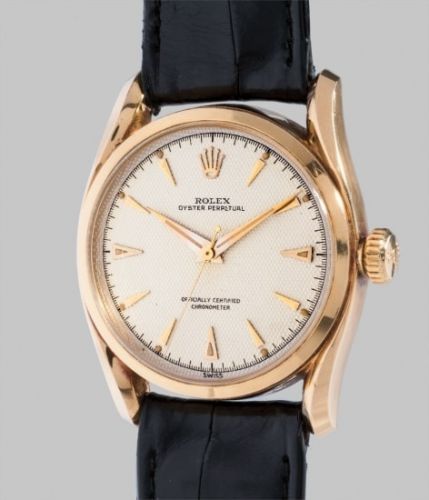 Rolex Follow;Ref. 6090;A very attractive yellow gold wristwatch with honeycomb dial, fancy lugs, original box and certificate