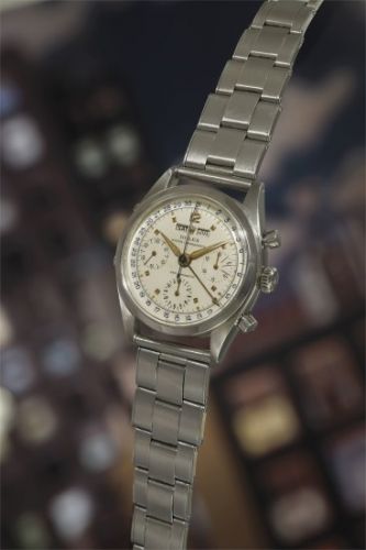 Rolex Follow;Ref. 6236;A very attractive and rare stainless steel triple calendar chronograph wristwatch with gold colored hour markers, and original bracelet.