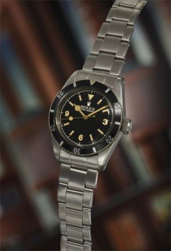 Rolex Follow;Ref. 6200;An extremely rare, important, and early stainless steel wristwatch with black glossy Explorer dial, gilt hands, presentation box, and hangtags.