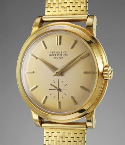 Patek Philippe Follow;Ref. 2552;An attractive and rare self-winding yellow gold wristwatch with bracelet, retailed by Tiffany Co.