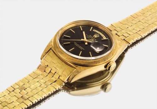 Rolex Follow;Ref. 1806;A very rare and extremely attractive gold wristwatch with sweep centre seconds, day, date, black lacquered dial and bracelet