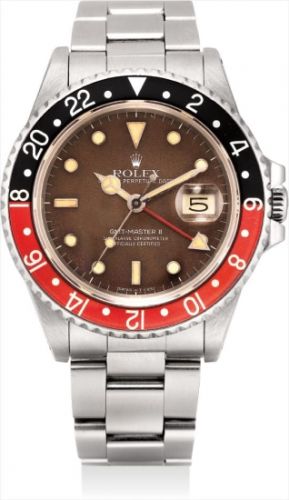 Rolex Follow;Ref. 16760;An attractive stainless steel dual time wristwatch with 'tropical dial', original guarantee, sales receipt and presentation box