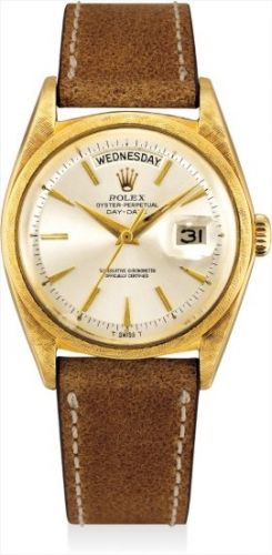 Rolex Follow;Ref. 1806, inside case back stamped 1803;A fine and rare gold calendar wristwatch