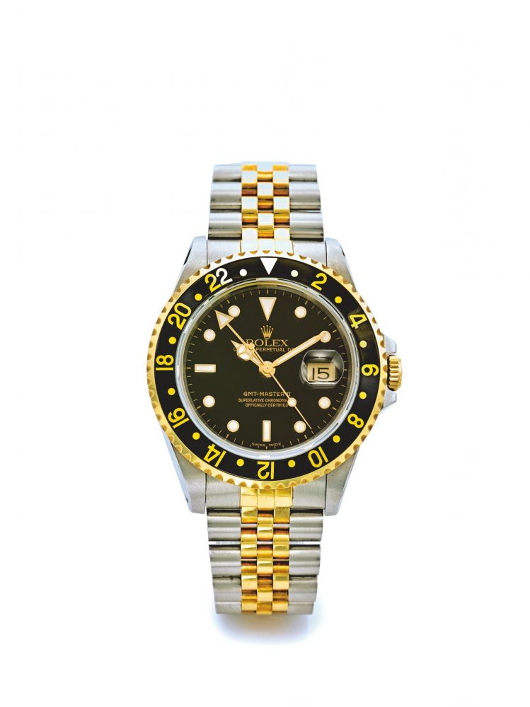 ROLEX | REF 16713 GMT-MASTER II, A STAINLESS STEEL AND YELLOW GOLD AUTOMATIC DUAL TIME ZONE WRISTWATCH WITH DATE AND BRACELET CIRCA 1990