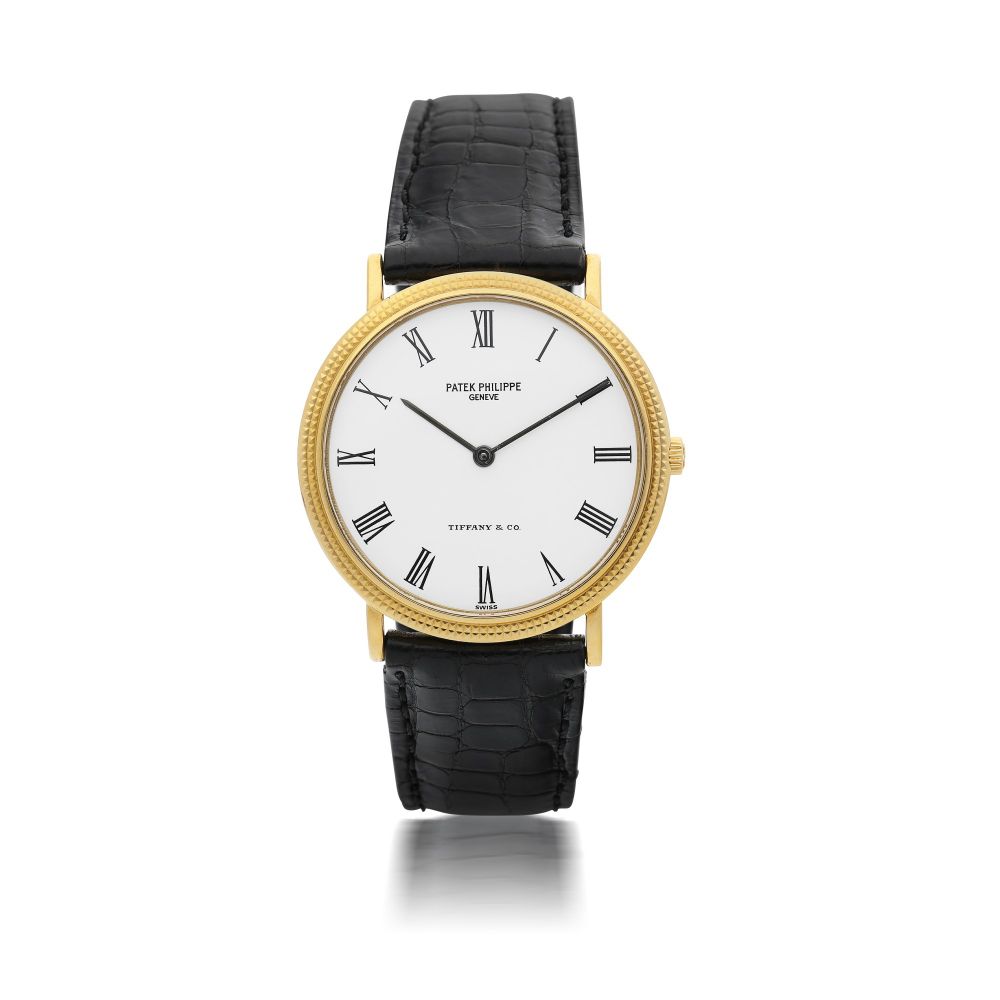PATEK PHILIPPE | REFERENCE 3954J RETAILED BY TIFFANY CO.: A YELLOW GOLD WRISTWATCH, CIRCA 1988