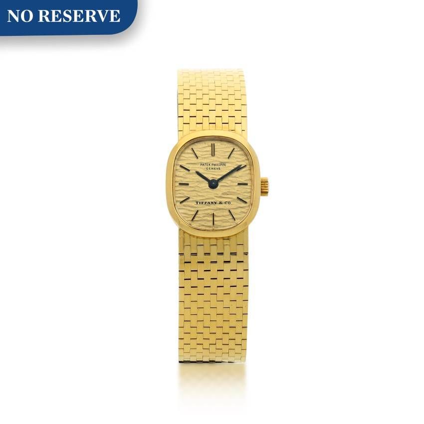 PATEK PHILIPPE | REFERENCE 4106 RETAILED BY TIFFANY CO.: A YELLOW GOLD BRACELET WATCH, MADE IN 1974