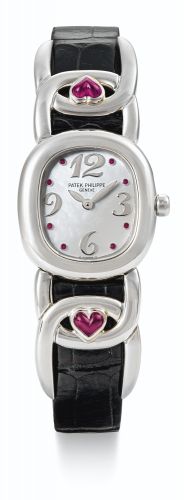 Patek Philippe.A LADY'S WHITE GOLD OVAL WRISTWATCH WITH MOTHER-OF-PEARL DIAL AND RUBY-SET INDEXES REF 4833/12 MVT 1626081 CASE 2972462 ELLIPSE MADE IN 1995