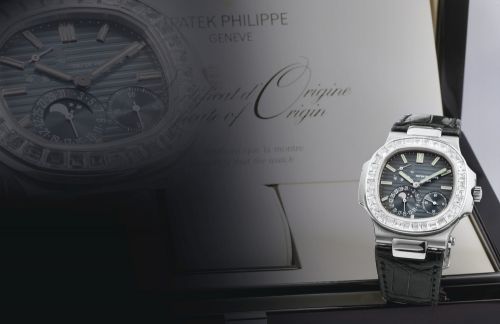 Patek Philippe.A FINE WHITE GOLD AND DIAMOND-SET CUSHION-FORM AUTOMATIC WRISTWATCH WITH DATE, MOON-PHASES AND POWER RESERVE INDICATION REF 5722G MVT 3179467 CASE 4458584 NAUTILUS CIRCA 2009