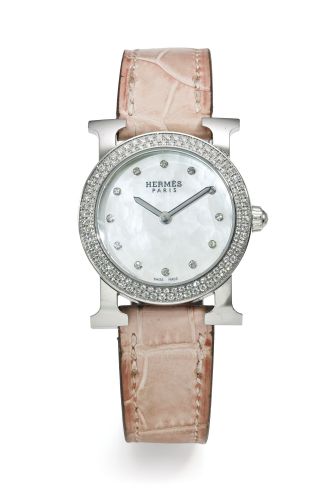 Hermès.A LADY'S STAINLESS STEEL AND DIAMOND-SET WRISTWATCH REF HR1.230 CASE 2507049 HEURE H RONDE CIRCA 2000