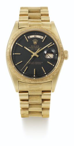 Rolex.A FINE AND RARE YELLOW GOLD AUTOMATIC CENTER SECONDS WRISTWATCH WITH CHINESE DAY, DATE AND BARK-FINISH BRACELET REF 1811 CASE 2608379 DAY-DATE CIRCA 1970