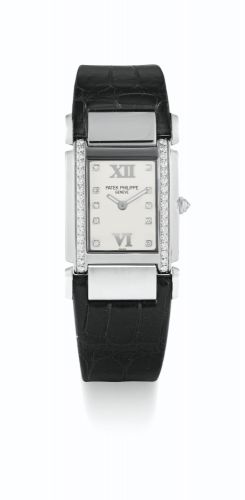 Patek Philippe.A LADY'S WHITE GOLD AND DIAMOND-SET RECTANGULAR WRISTWATCH WITH DIAMOND-SET INDEXES REF 4920G MVT 3381338 CASE 4287794 CIRCA 2004