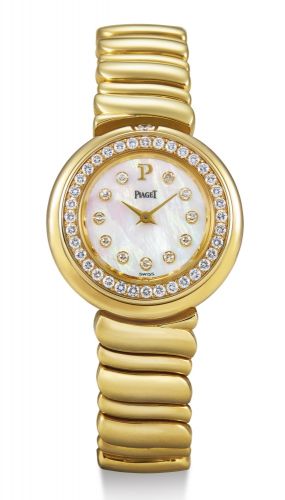 Piaget.A LADY'S YELLOW GOLD AND DIAMOND-SET BRACELET WATCH WITH MOTHER-OF-PEARL DIAL CASE 20127M101 SERIAL 651403 POSSESSION CIRCA 1996.A LADY'S YELLOW GOLD AND DIAMOND-SET BRACELET WATCH WITH MOTHER-OF-PEARL DIAL CASE 20127M101 SERIAL 651403 POSSESSION C