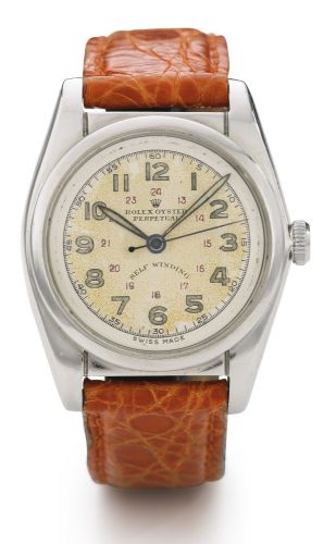 Rolex A STAINLESS STEEL AUTOMATIC CENTRE SECONDS WRISTWATCH REF 5050 CASE 660696 BUBBLEBACK CIRCA 1960