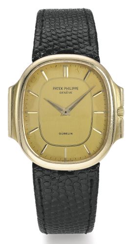 Patek Philippe RETAILED BY GÜBELIN: A YELLOW GOLD OVAL WRISTWATCH REF 3770 MVT 1504724 CASE 552612 NAUTILUS MADE IN 1981