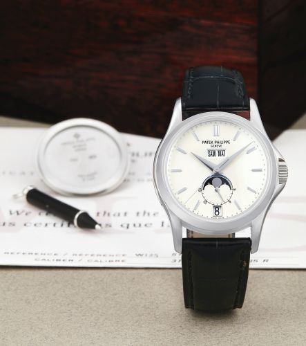 Patek Philippe A LIMITED EDITION WHITE GOLD AUTOMATIC ANNUAL CALENDAR WRISTWATCH WITH MOON-PHASES AND 24-HOUR INDICATION, RETAILED BY WEMPE REF 5125G-001 MVT 3360300 CASE 4213430 NO 067/125 W125 CIRCA 2003