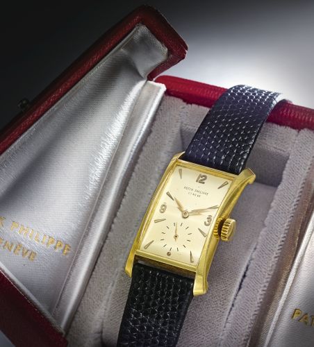 Patek Philippe A FINE YELLOW GOLD FLARED RECTANGULAR WRISTWATCH REF 2468 MVT 974619 CASE 673443 MADE IN 1952