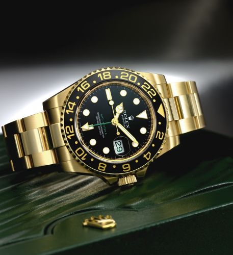 Rolex A YELLOW GOLD AUTOMATIC SWEEP SECONDS DUAL TIME ZONE WRISTWATCH WITH BRACELET WITH DATE AND BRACELET REF 116718 CASE M437753 GMT-MASTER II CIRCA 2007