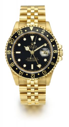Rolex A YELLOW GOLD AUTOMATIC DUAL TIME ZONE CENTER SECONDS WRISTWATCH WITH DATE AND BRACELET REF 16718 CASE N230100 GMT-MASTER II CIRCA 1992