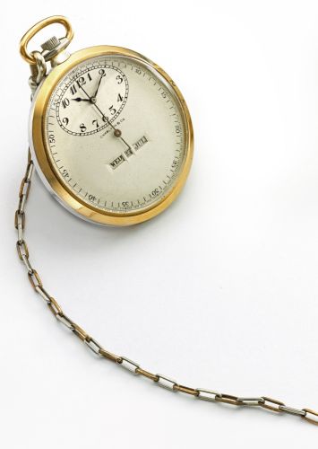 Swiss RETAILED BY CHARLTON CO.: A FINE PLATINUM AND PINK GOLD OPEN FACED CALENDAR WATCH WITH CENTER SECONDS NO 210061 CIRCA 1930