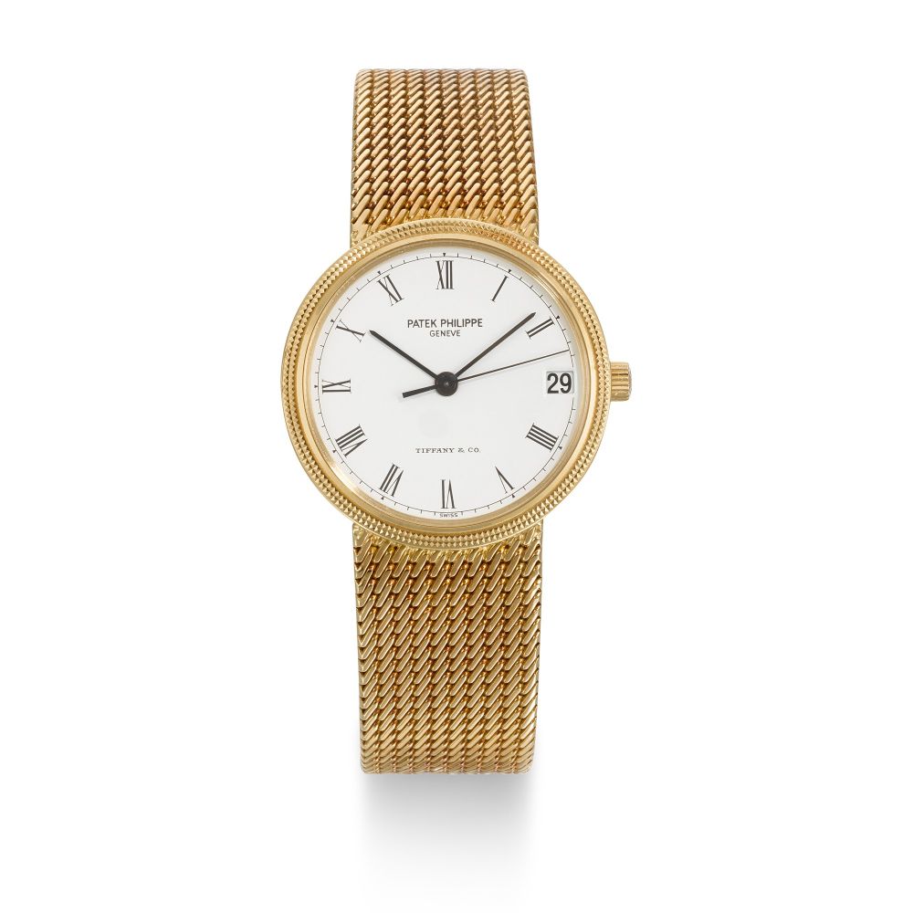 PATEK PHILIPPE | CALATRAVA DOUBLE-SIGNED TIFFANY CO, REF 3802/205J, YELLOW GOLD BRACELET WATCH WITH DATE AND RETAILER SIGNATURE, CIRCA 2000