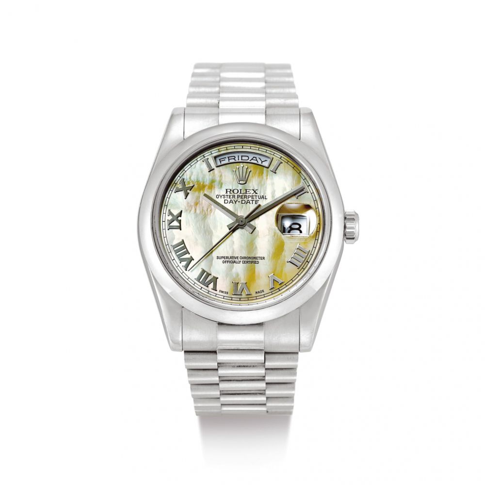 ROLEX | DAY-DATE, REFERENCE 118209 A WHITE GOLD WRISTWATCH WITH DAY, DATE, MOTHER-OF-PEARL DIAL AND BRACELET, CIRCA 2002  | 勞力士 | Day-Date 型號118209 白金鏈帶腕錶，備日期、星期顯示及珠母貝錶盤，錶殼編號Y469943，約2002年製