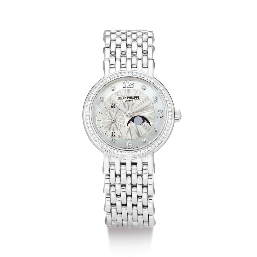 PATEK PHILIPPE | REFERENCE 4958/1 A WHITE GOLD AND DIAMOND-SET BRACELET WATCH WITH MOON PHASES AND MOTHER-OF-PEARL DIAL, CIRCA 2009 | 百達翡麗 | 型號4958/1 白金鑲鑽石鏈帶腕錶，備月相顯示及珠母貝錶盤，機芯編號3701303，錶殼編號4926081，約2009年製