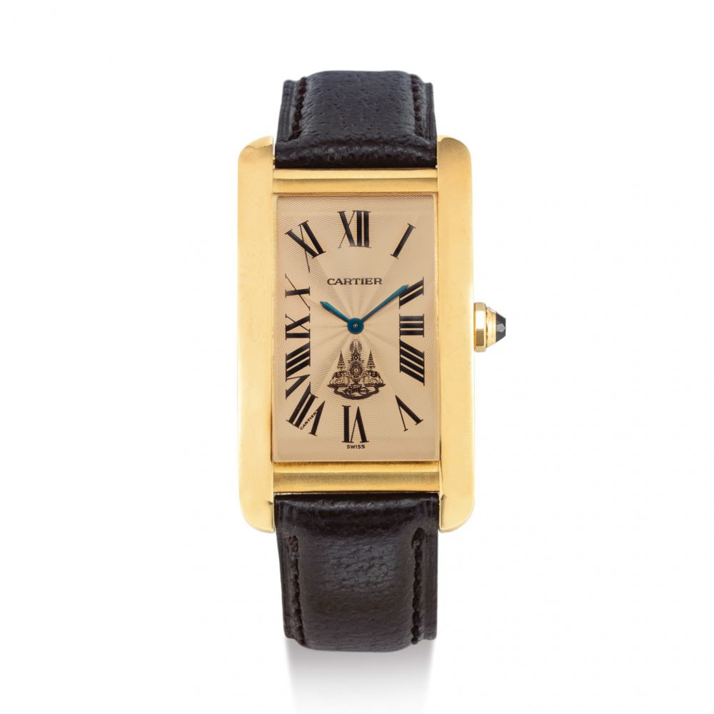 CARTIER | TANK AMERICAINE, REFERENCE 1735 1 A YELLOW GOLD WRISTWATCH WITH SALMON DIAL, MADE FOR KING OF SIAM, CIRCA 1990  | 卡地亞 | Tank Americaine 型號1735 1 黃金腕錶，備鮭魚色錶盤，為暹羅國王而製，錶殼編號9312774，約1990年製