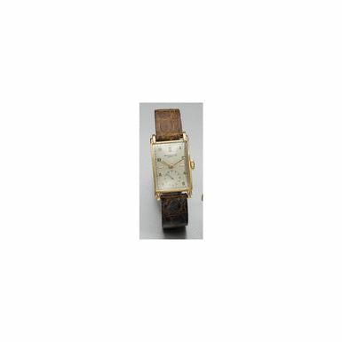 A FINE AND RARE PINK GOLD CURVED RECTANGULAR WRISTWATCH, PATEK PHILIPPE CO., GEN