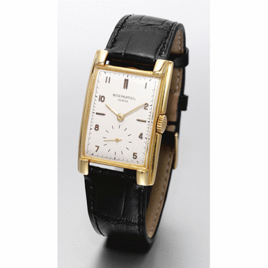 PATEK PHILIPPE - A fine, rare and large gold curved rectangular wristwatch, circa 1947, no.976.764, ref.1570