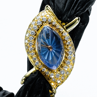 AUDEMARS PIGUET CORUM, A LADY'S GOLD AND DIAMOND SET MARQUISE FORM WRISTWATCH WITH AMETHYST TOP CIRCA 1995 - NBSP