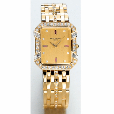 PATEK PHILIPPE, A GOLD, DIAMOND AND RUBY SET RECTANGULAR BRACELET WATCH CIRCA 1990 REF 3833 MVT NO 1549218 CASE NO 2855888
