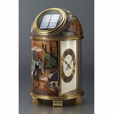 Property from the Estate of Charles and Yvette Bluhdorn - PATEK PHILIPPE - A fine and unique gilt-brass solar-powered desk timepiece with cloisonn