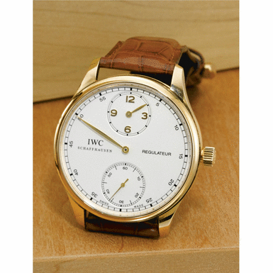 INTERNATIONAL WATCH CO. - A pink gold wristwatch with regulator-style dial Circa 2005 ref 5444 portuguese regulateur