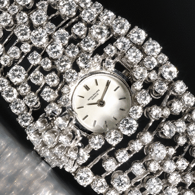 PATEK PHILIPPE, AN EXCEPTIONALLY FINE LADY'S ONLY KNOWN PLATINUM AND DIAMOND SET BRACELET WATCH WITH CONCEALED DIAL CIRCA 1974 REF 3382/1P RIVIERE MVT 1248640 CASE 2634594