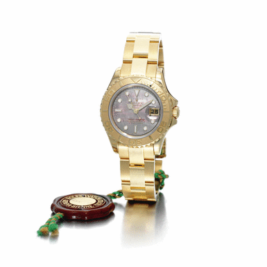 ROLEX - A lady's gold automatic centre seconds wristwatch with mother-of-pearl dial, date and bracelet circa 2005 ref 169628 oyster perpetual yacht-master