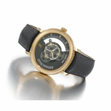 AUDEMARS PIGUET - A LARGE AND UNUSUAL LIMITED EDITION OVAL PINK GOLD AUTOMATIC WANDERING HOUR WRISTWATCH CIRCA 2000 STAR WHEEL MILLENARY