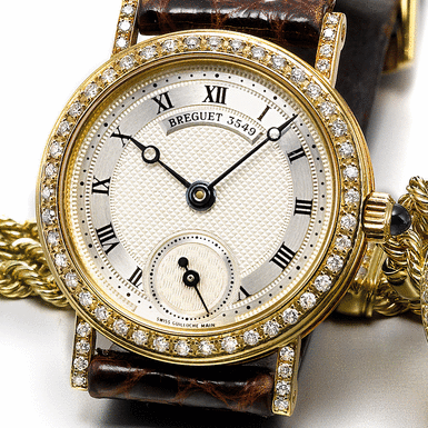 BREGUET, A LADY'S YELLOW GOLD AND DIAMOND SET WRISTWATCH CIRCA 1990 MARINE REF 8171