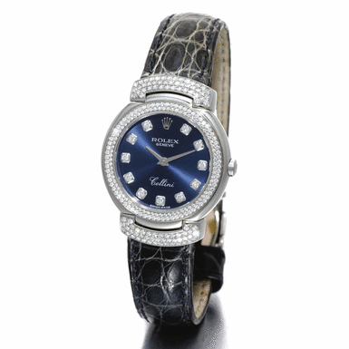 ROLEX - A LADY'S WHITE GOLD AND DIAMOND SET WRISTWATCH WITH HINGED HOODED LUGS CIRCA 2002 REF 6673 CELLINI