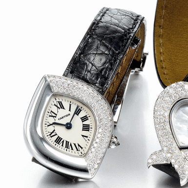 CARTIER - A LADY'S WHITE GOLD AND DIAMOND SET ASYMMETRICAL WRISTWATCH CIRCA 2000