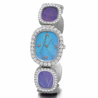 PATEK PHILIPPE - A LADY'S WHITE GOLD AND DIAMOND OVAL BRACELET WATCH WITH BUTTERFLY WING DIAL 1971 REF 4117/1G MVT 1245022 CASE 2714459