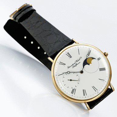 IWC - A FINE AND RARE YELLOW GOLD WRISTWATCH WITH MOON-PHASES CIRCA 1990 REF 5251 PORTOFINO MVT 2317975 CASE 2465462